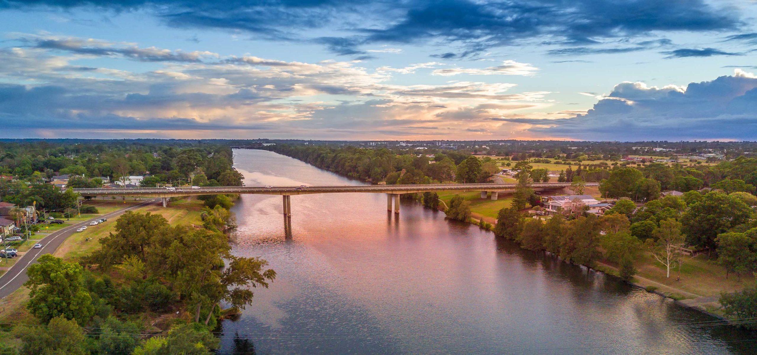 Nepean River Penrith with semi cloudy skies at sunrise