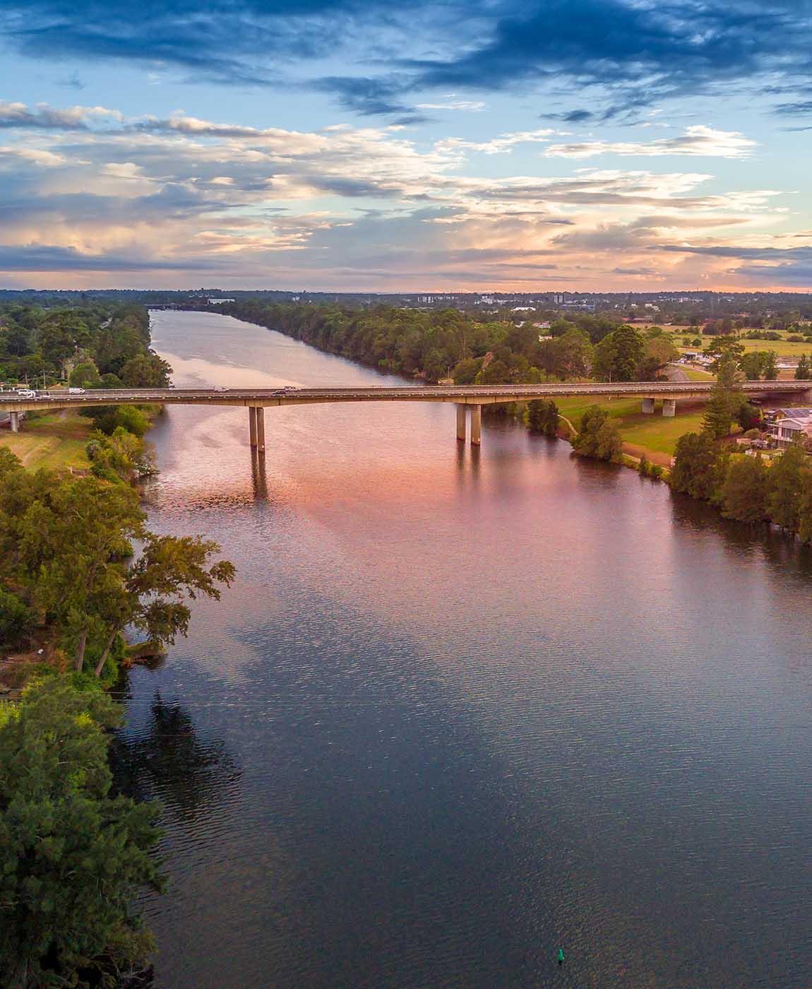 Nepean River Penrith with semi cloudy skies at sunrise